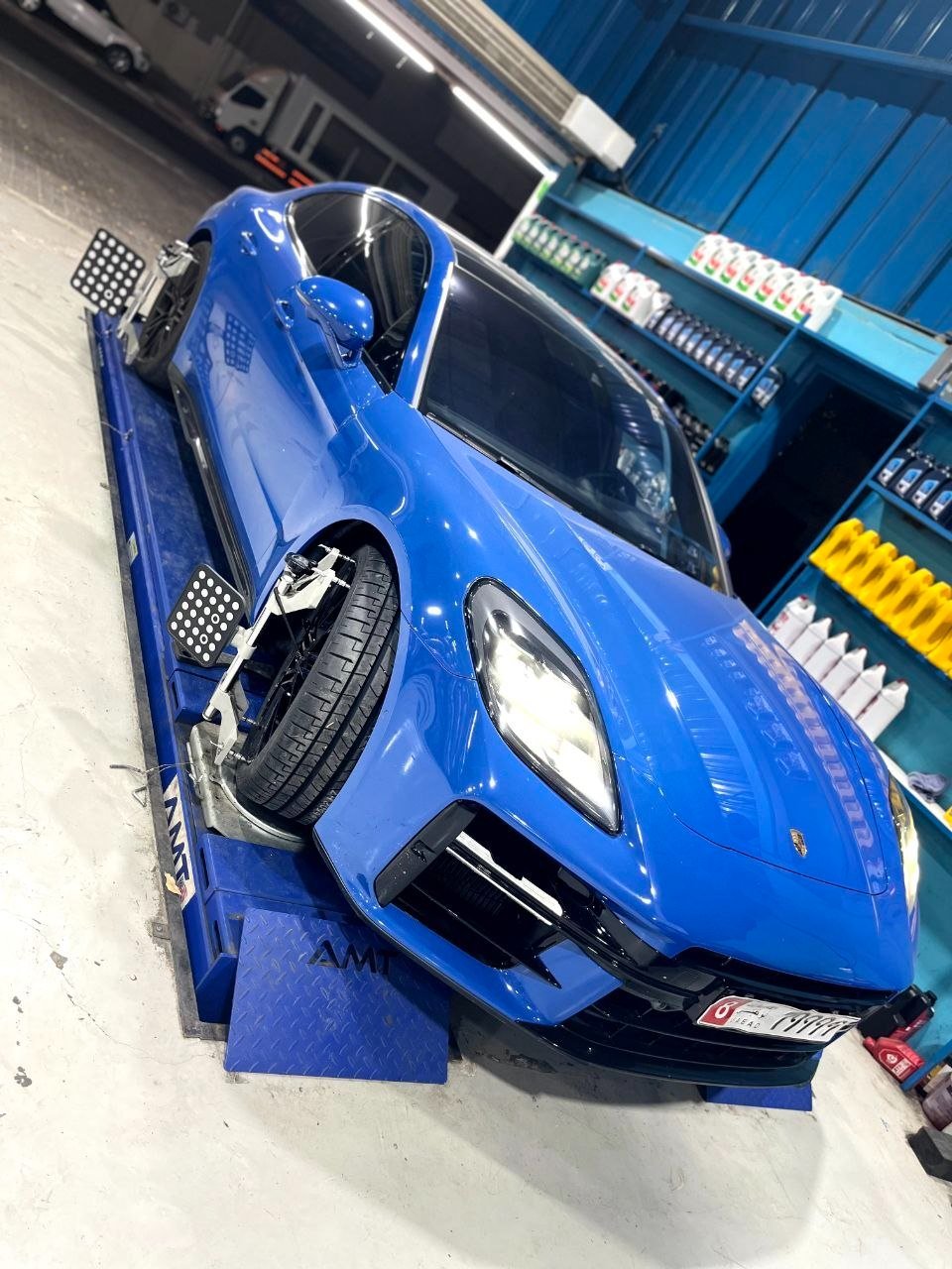 Porsche on the alignment rig at SP7 with wheel clamps fitted